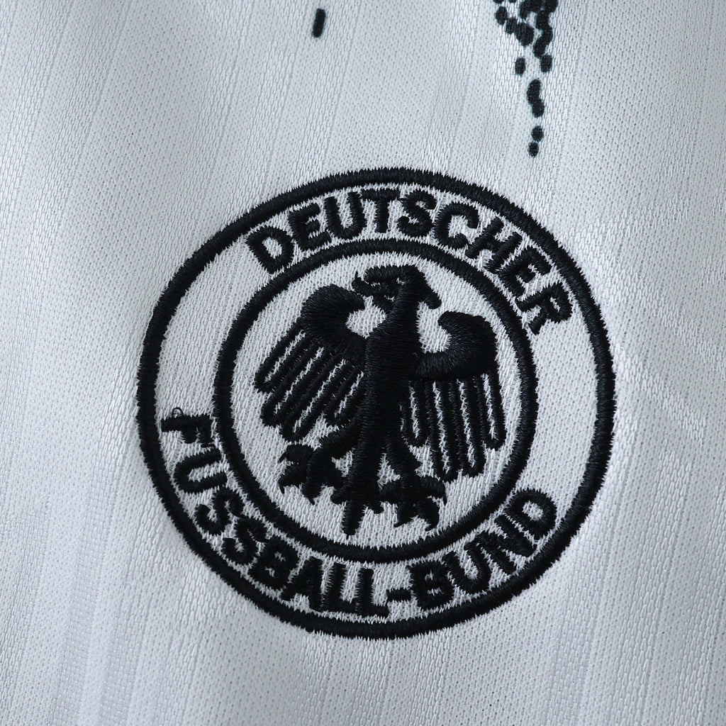 Elite Retro Kits Germany 1994 home kids kit featuring a detailed black embroidered DFB crest on a white jersey