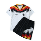 Elite Retro Kits kids Germany 1994 home football kit featuring a white jersey and black shorts with iconic flag pattern