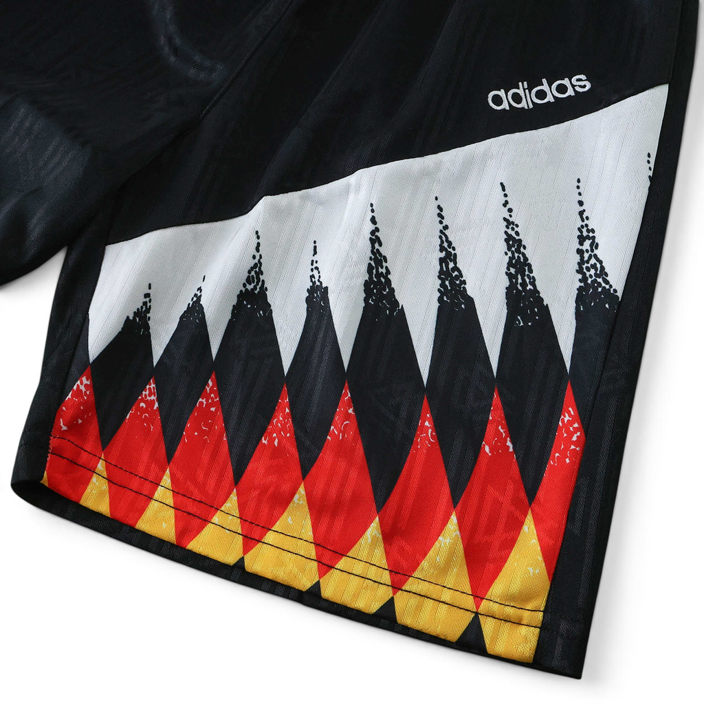 Elite Retro Kits Germany 1994 kids football shorts featuring black, red, and yellow diamond pattern and adidas logo