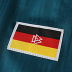 Elite Retro Kits Germany 1996 away shirt detail featuring the German flag patch with DFB eagle logo on green fabric