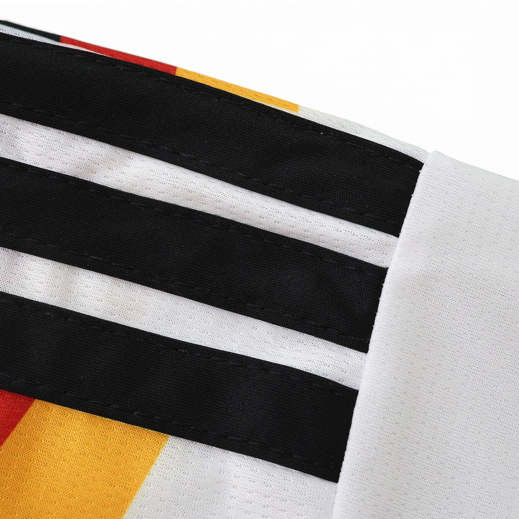 Elite Retro Kits Germany 2026 home kids kit sleeve detail featuring black stripes on white fabric with red and gold