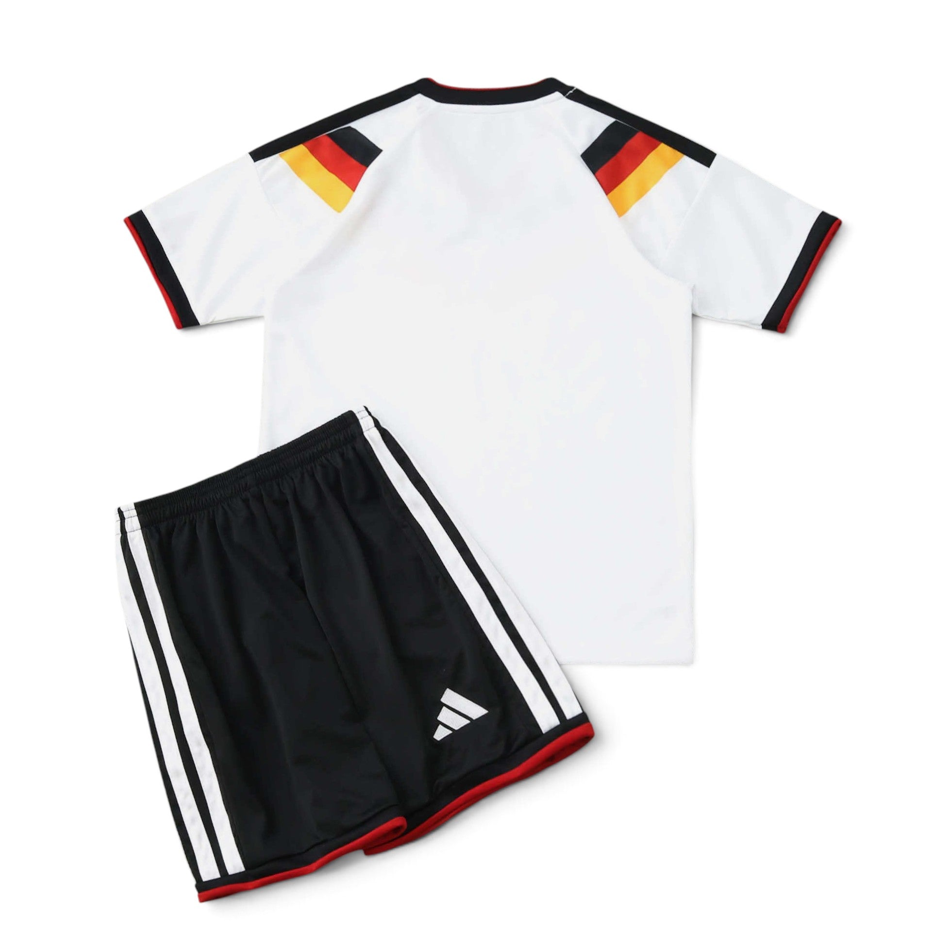 Elite Retro Kits Germany 2026 kids home kit featuring a white jersey with flag-colored shoulders and black shorts.