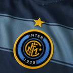 Elite Retro Kits Inter Milan 2004/05 third shirt detail featuring the club crest and yellow star on blue striped fabric
