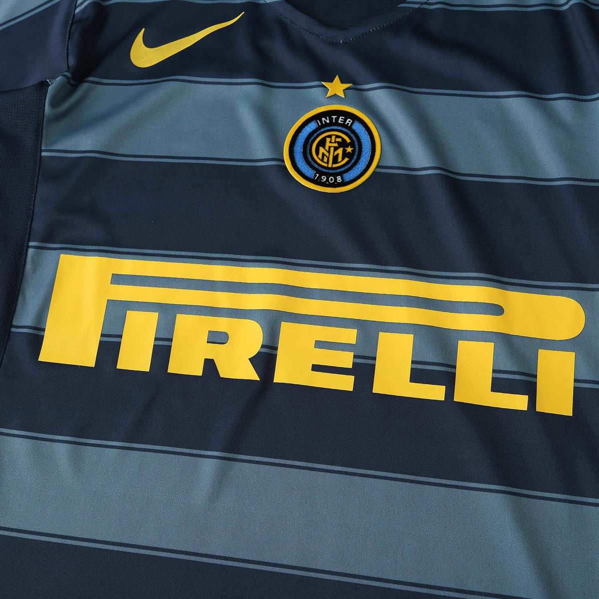 Elite Retro Kits Inter Milan 2004/05 third football shirt featuring dark blue and grey stripes with yellow Pirelli logo