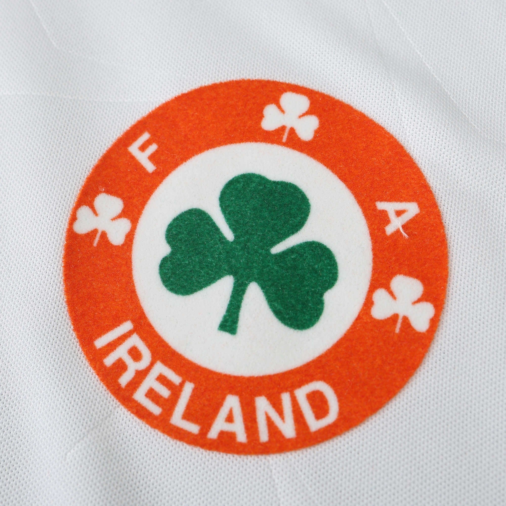 Elite Retro Kits Ireland 1990 away football shirt featuring the classic orange and green FAI shamrock crest on white