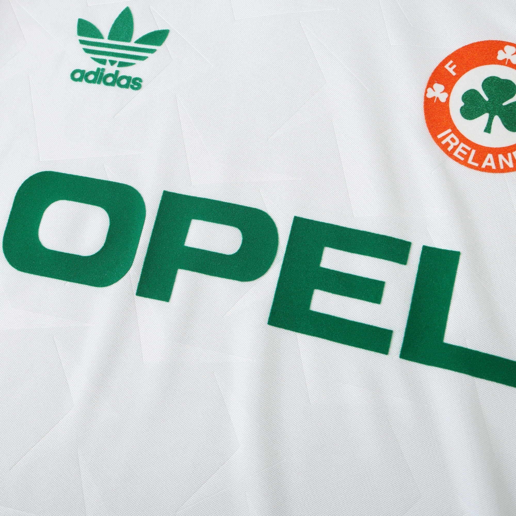 Elite Retro Kits white Ireland 1990 away football shirt featuring green Opel sponsor logo and FAI crest detail