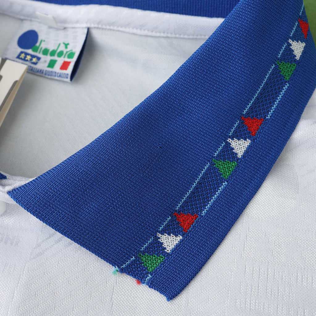 Elite Retro Kits Italy 1994 away shirt featuring a blue polo collar with red, white, and green triangular detailing.