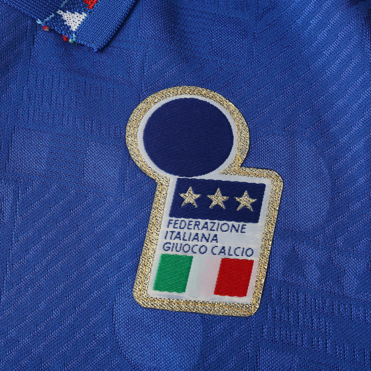Elite Retro Kits Italy 1994 home football shirt featuring the FIGC crest with three gold stars on blue patterned fabric