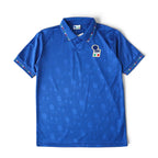 Elite Retro Kits Italy 1994 home football shirt in blue with subtle jacquard pattern, polo collar, and team crest.