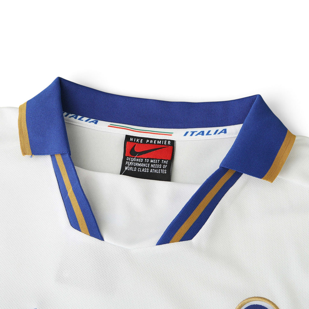 Elite Retro Kits Italy 1996 away football shirt featuring a white collar with blue and gold trim and Nike branding.
