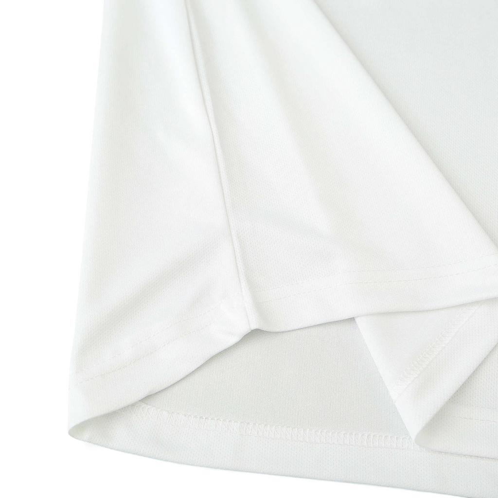 Close-up of the white fabric texture and hem detail on an Elite Retro Kits Italy 1996 away football shirt.