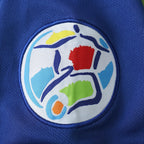 Elite Retro Kits Italy 1996 home shirt featuring a detailed embroidered FIGC crest on classic azzurro blue fabric
