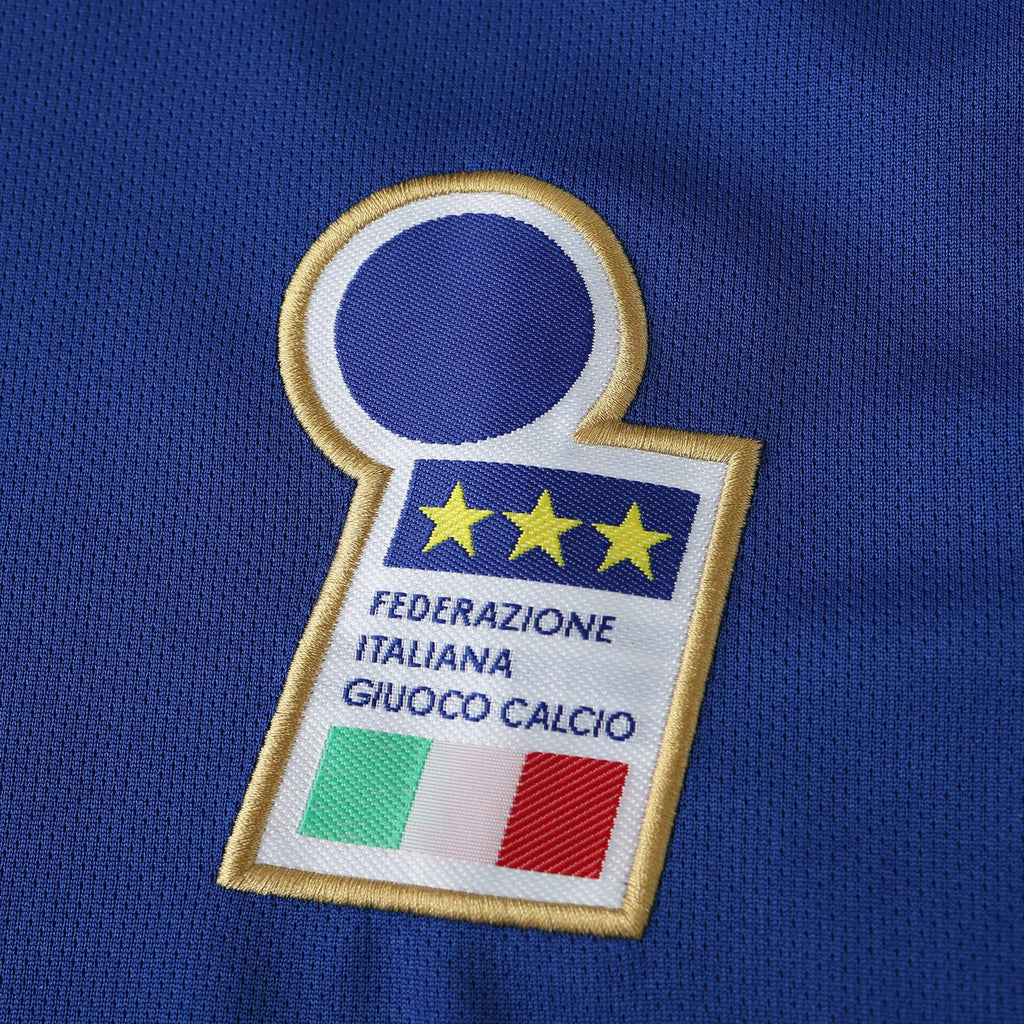 Elite Retro Kits Italy 1996 home shirt featuring the embroidered FIGC crest with three gold stars on azzurro blue fabric