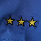 Elite Retro Kits Italy 2000 home shirt detail featuring three embroidered gold stars on deep azzurro blue fabric