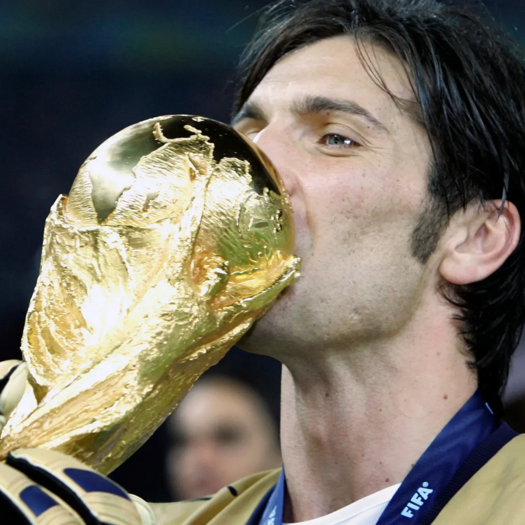 Elite Retro Kits Italy 2006 goalkeeper shirt worn by Gianluigi Buffon while kissing the World Cup trophy