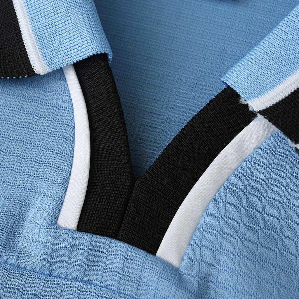 Elite Retro Kits Lazio 1998/99 home shirt featuring a sky blue textured fabric with a black and white polo collar.
