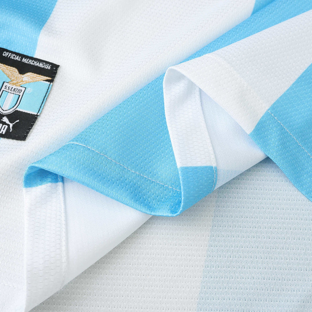 Elite Retro Kits Lazio 1999/00 home shirt in sky blue and white with the club eagle emblem and official tag detail.