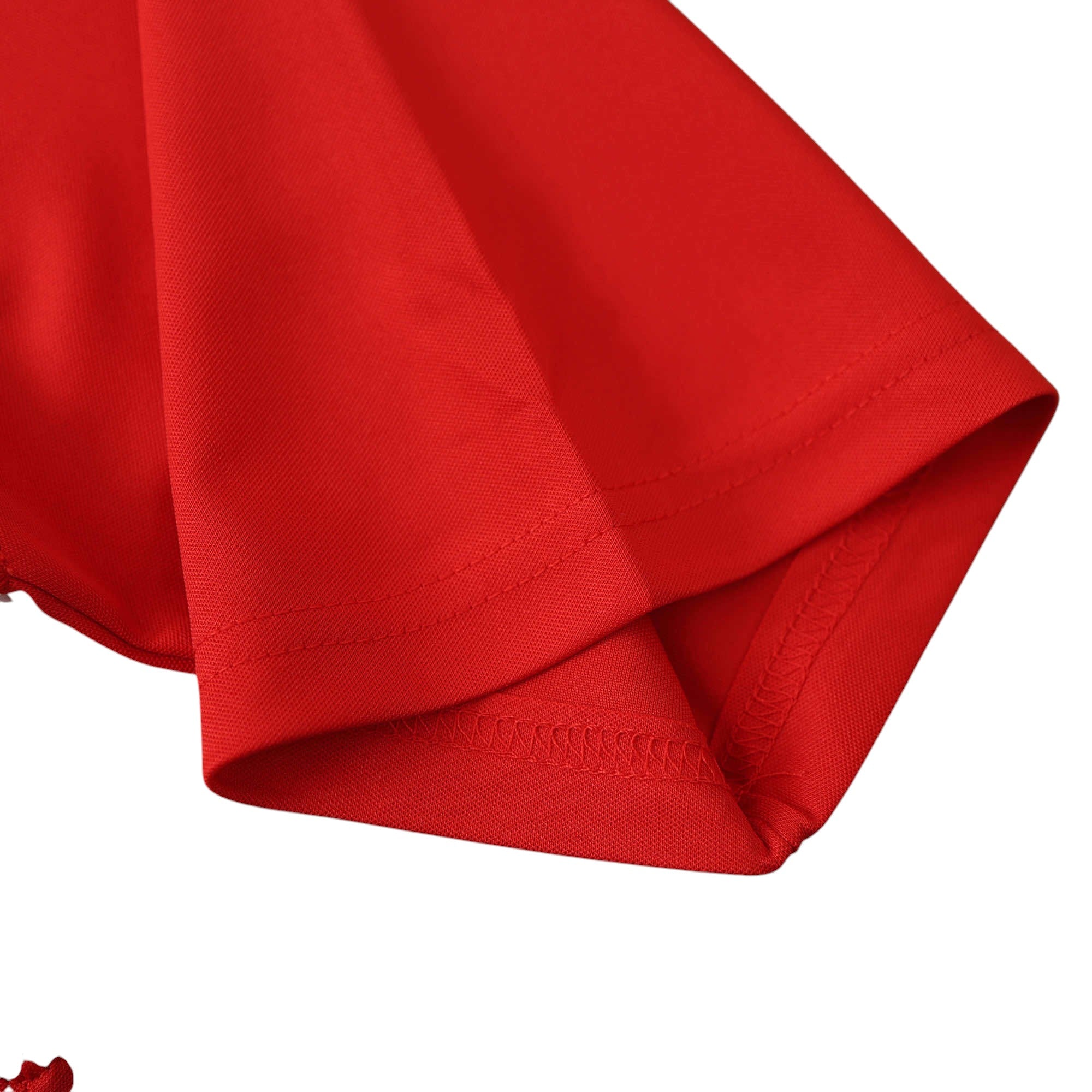 Close-up of the red sleeve on an Elite Retro Kits Liverpool 2004/05 Champions League final football shirt