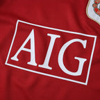 Elite Retro Kits Manchester United 2006/07 kids home jersey featuring the iconic red fabric and AIG sponsor logo