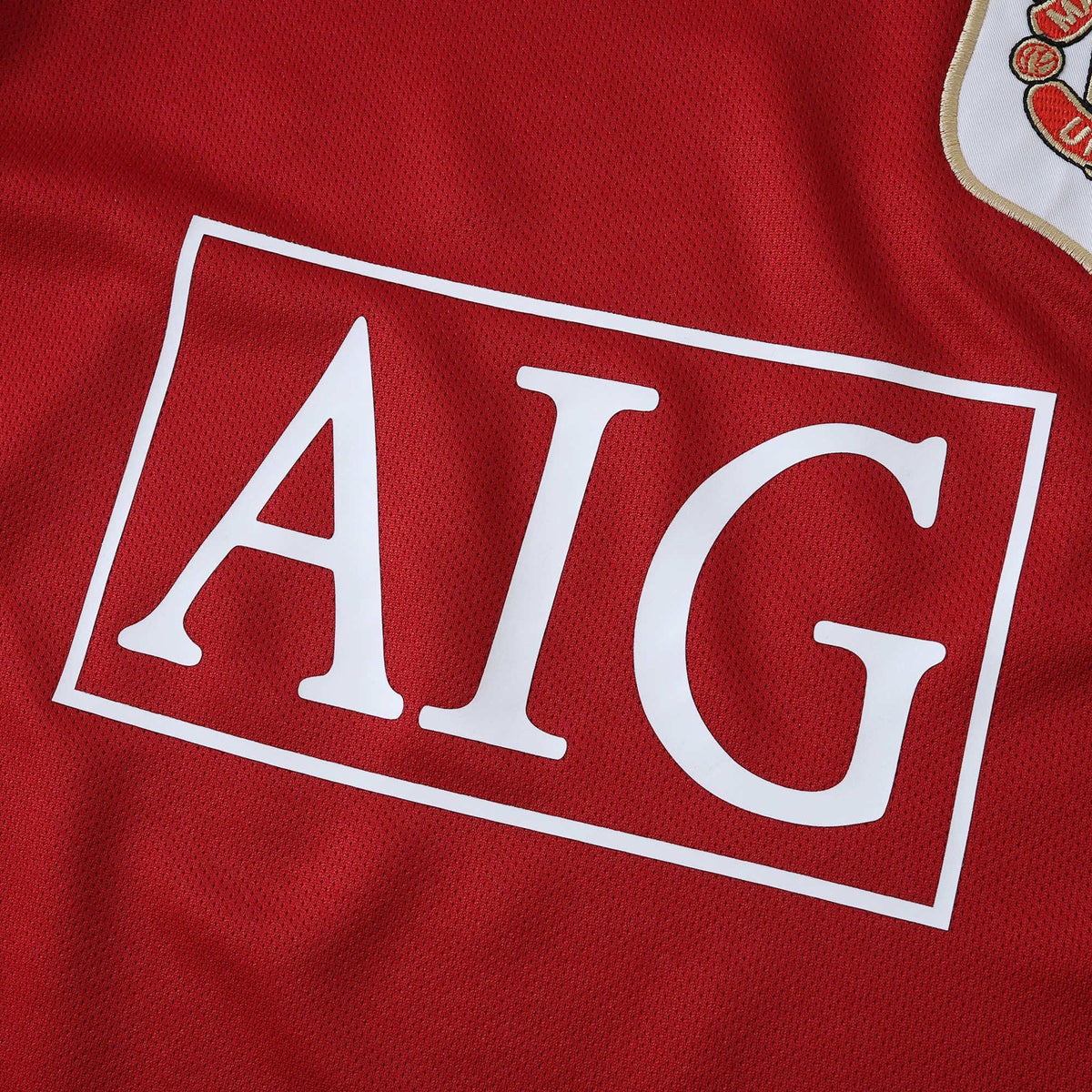 Elite Retro Kits Manchester United 2006/07 kids home jersey featuring the iconic red fabric and AIG sponsor logo