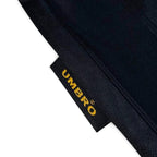 Elite Retro Kits Manchester United 1993-1995 away shirt detail showing the black fabric and yellow Umbro brand tag