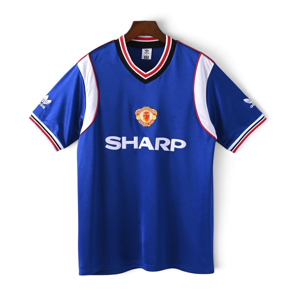 Elite Retro Kits Manchester United 1985/1986 away football shirt in blue with Sharp sponsor and adidas trim.