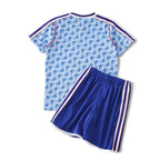 Elite Retro Kits Manchester United 1990/92 away kids kit featuring blue patterned jersey and matching blue shorts.