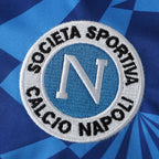 Elite Retro Kits Napoli 1991-93 home shirt featuring a detailed embroidered club crest on a blue tonal patterned fabric