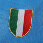 Elite Retro Kits Napoli 1987/88 home shirt featuring the Italian Scudetto shield emblem on sky blue fabric