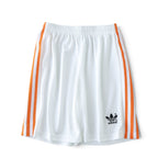 Elite Retro Kits kids Netherlands 1988 home football shorts in white with orange side stripes and black adidas logo