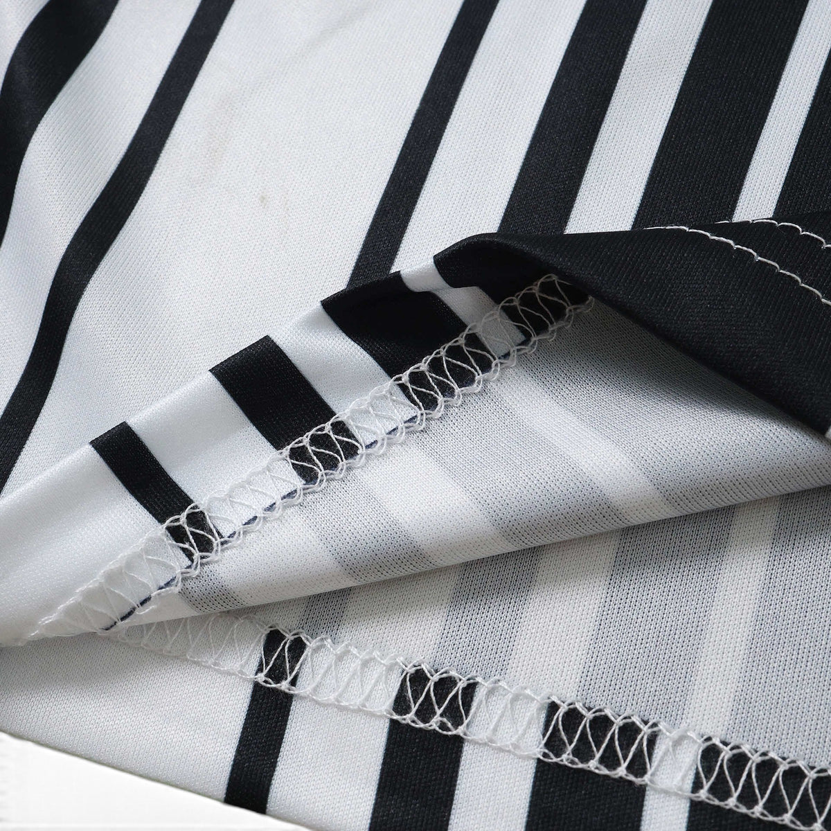 Elite Retro Kits Newcastle 2026/27 home shirt fabric detail showing black and white stripes and white stitching