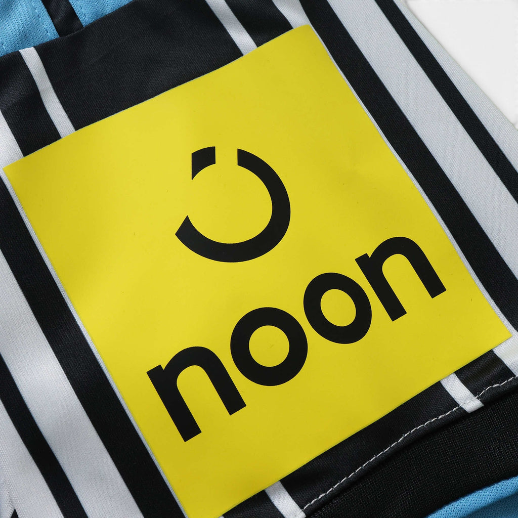 Elite Retro Kits Newcastle 2026/27 home shirt featuring black and white stripes with a yellow noon sponsor logo
