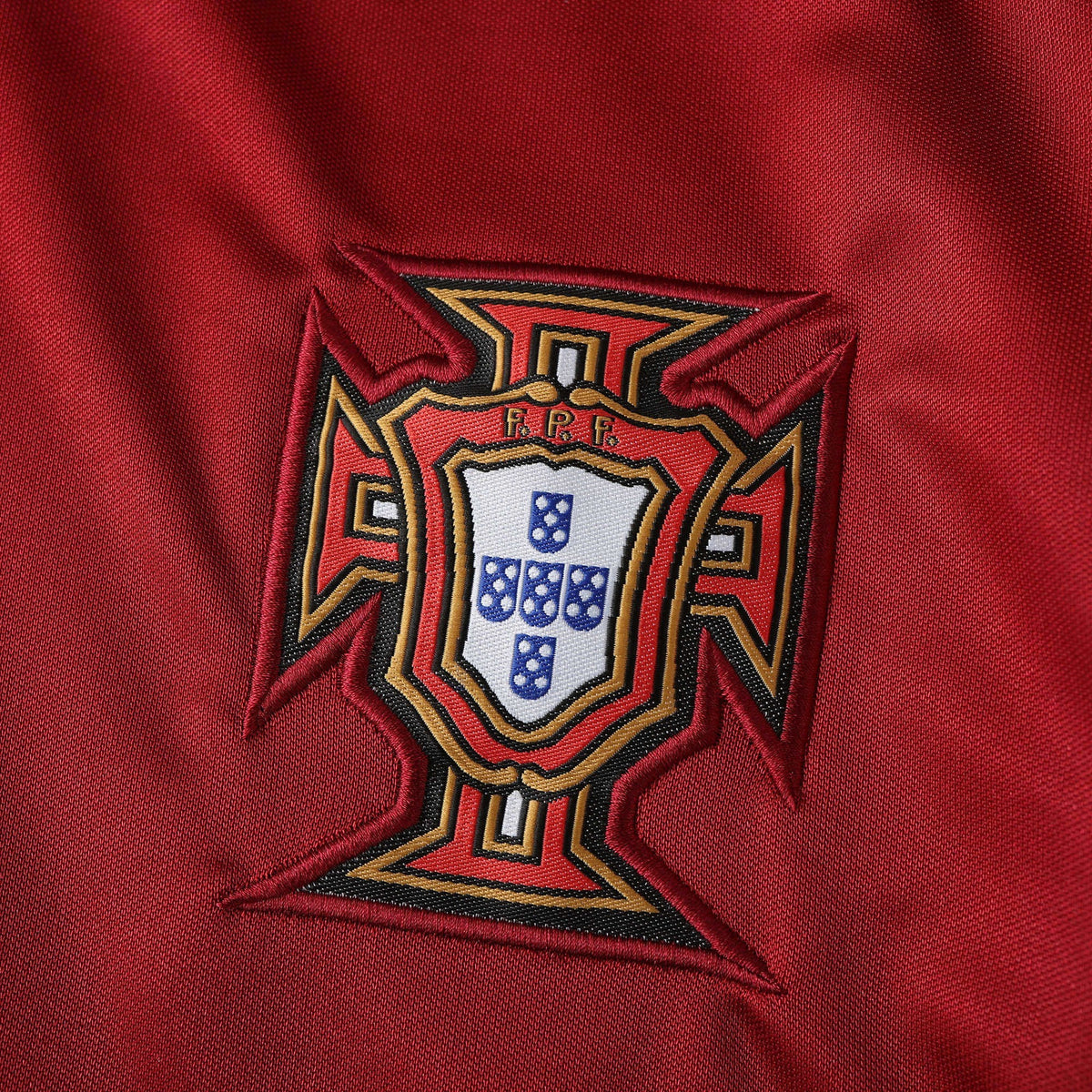 Elite Retro Kits Portugal 1998 home shirt featuring a detailed embroidered FPF crest on classic red fabric