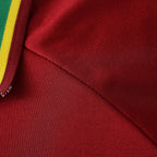 Elite Retro Kits Portugal 1998 home football shirt detail showing red fabric and green and yellow collar trim