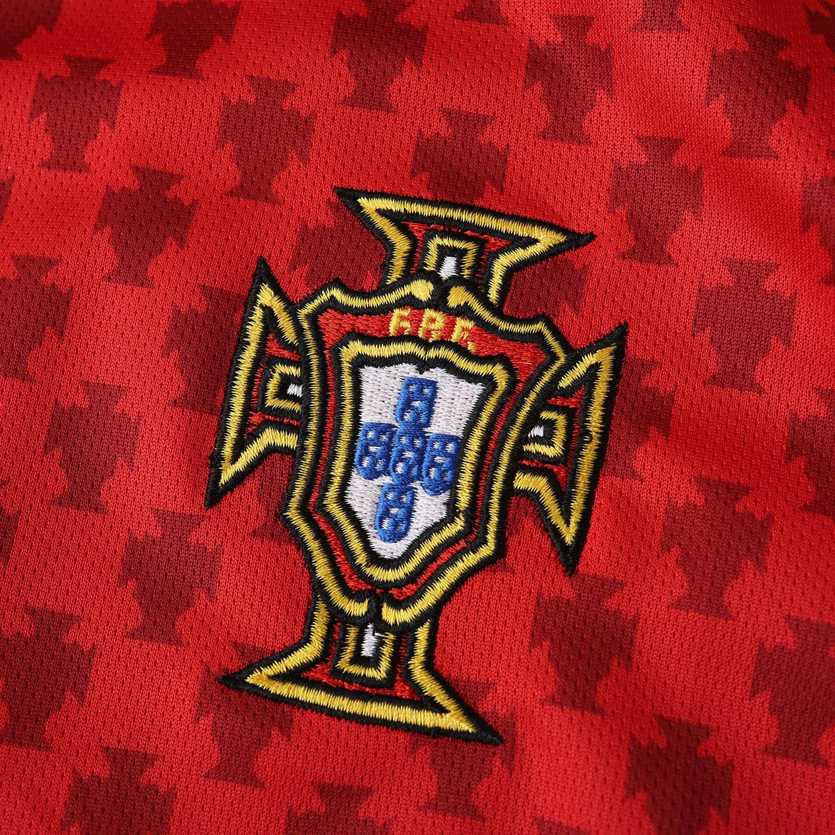 Elite Retro Kits Portugal 2004 home shirt featuring a detailed embroidered FPF crest on a red patterned fabric