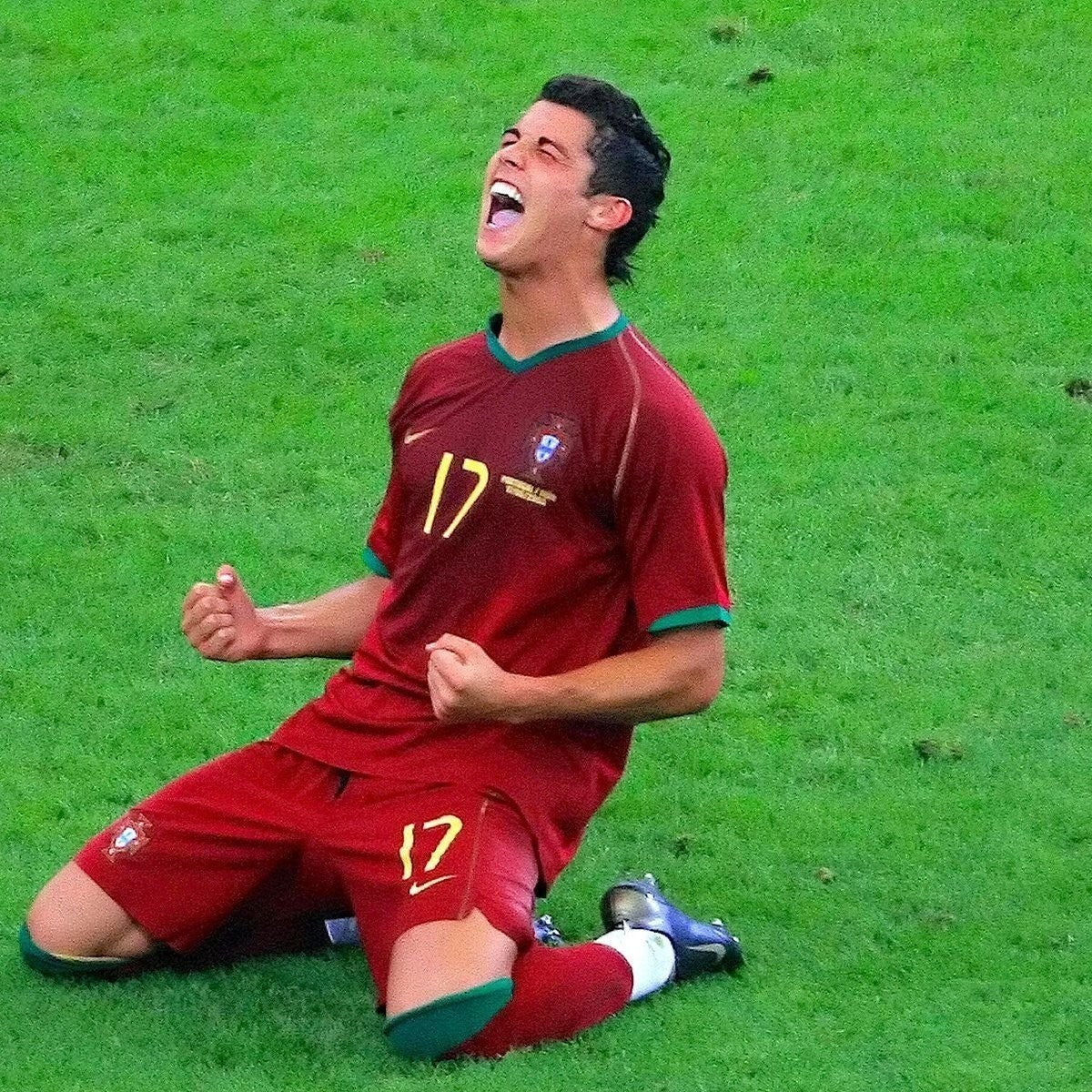 Elite Retro Kits Portugal 2006 home shirt in red with green trim, worn by Cristiano Ronaldo celebrating on the pitch.
