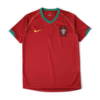 Elite Retro Kits Portugal 2006 home football shirt in red with green trim, gold Nike swoosh, and FPF crest.