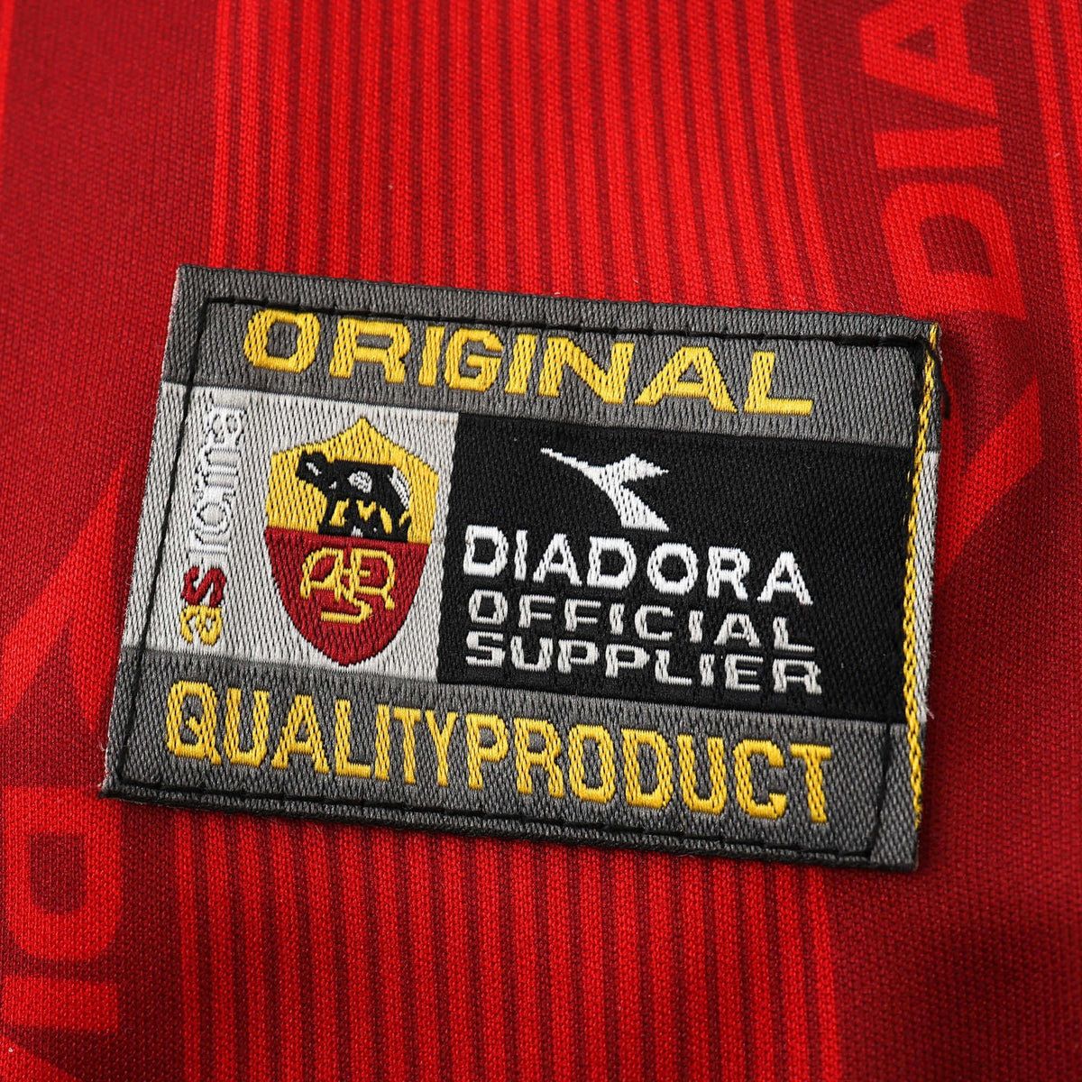 Elite Retro Kits Roma 1999/00 home shirt original quality product patch detail on deep red textured fabric