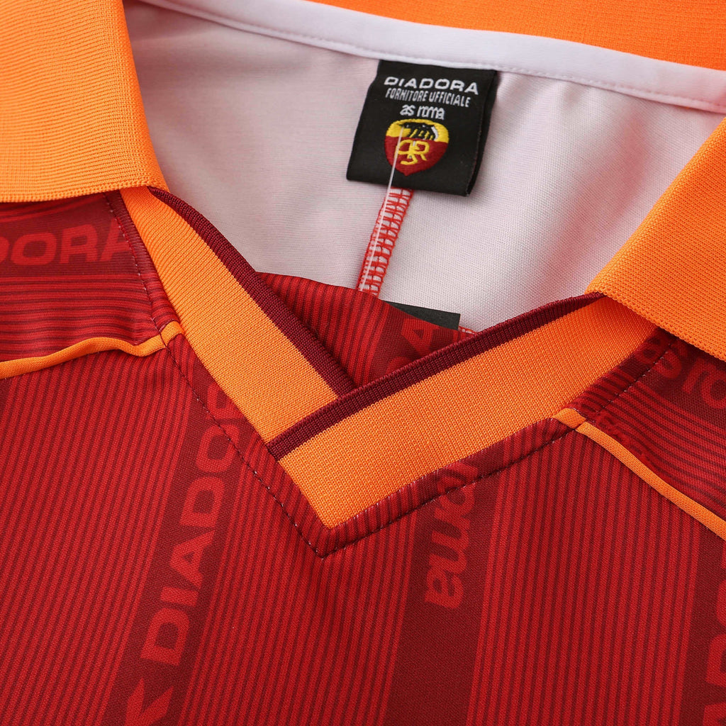 Elite Retro Kits Roma 1999/00 home shirt featuring deep red fabric, orange collar, and Diadora branding details.
