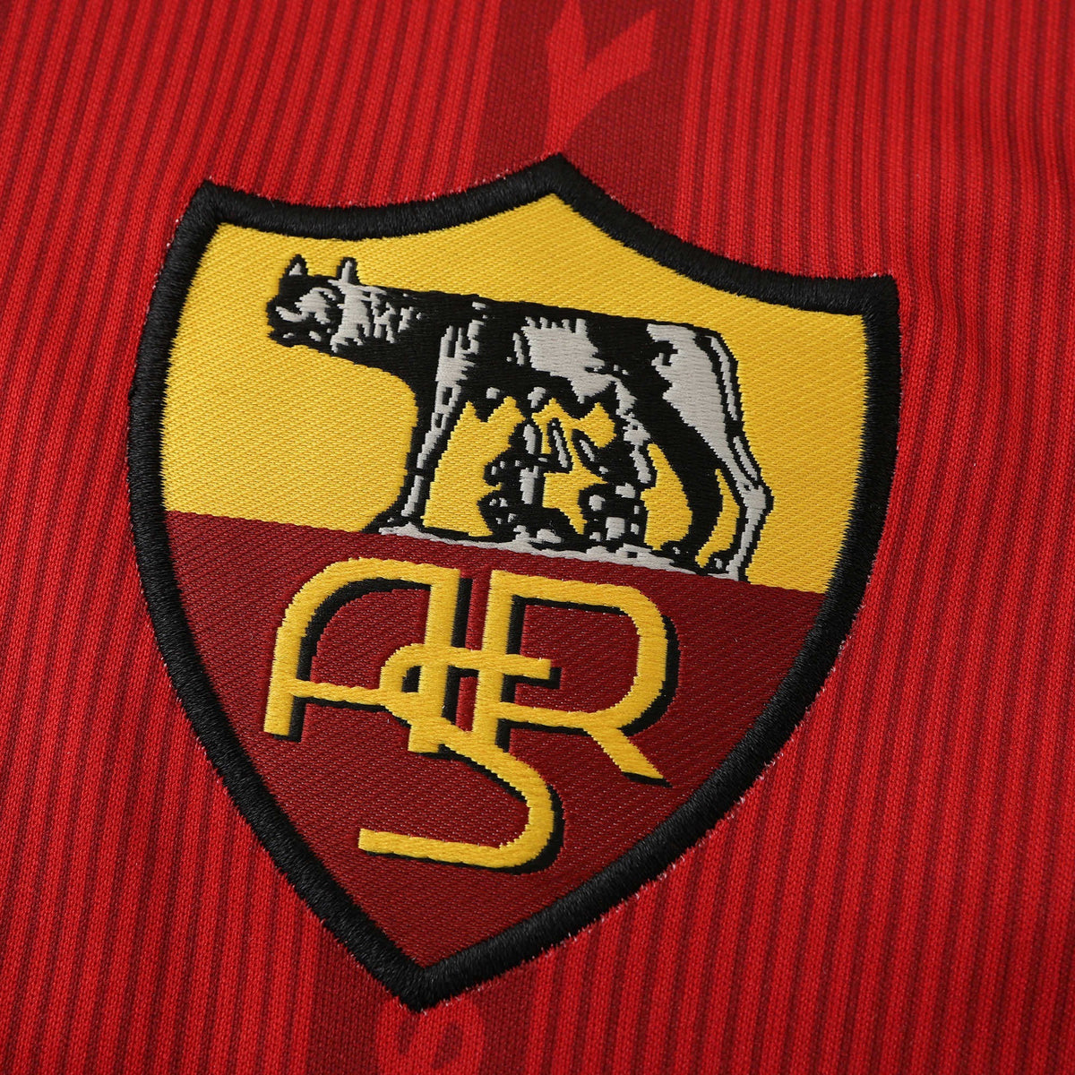 Elite Retro Kits Roma 1999/00 home shirt embroidered club crest featuring the iconic wolf logo on red textured fabric