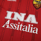 Elite Retro Kits Roma 1999/00 home shirt featuring deep red fabric, AS Roma crest, and INA Assitalia sponsor logo