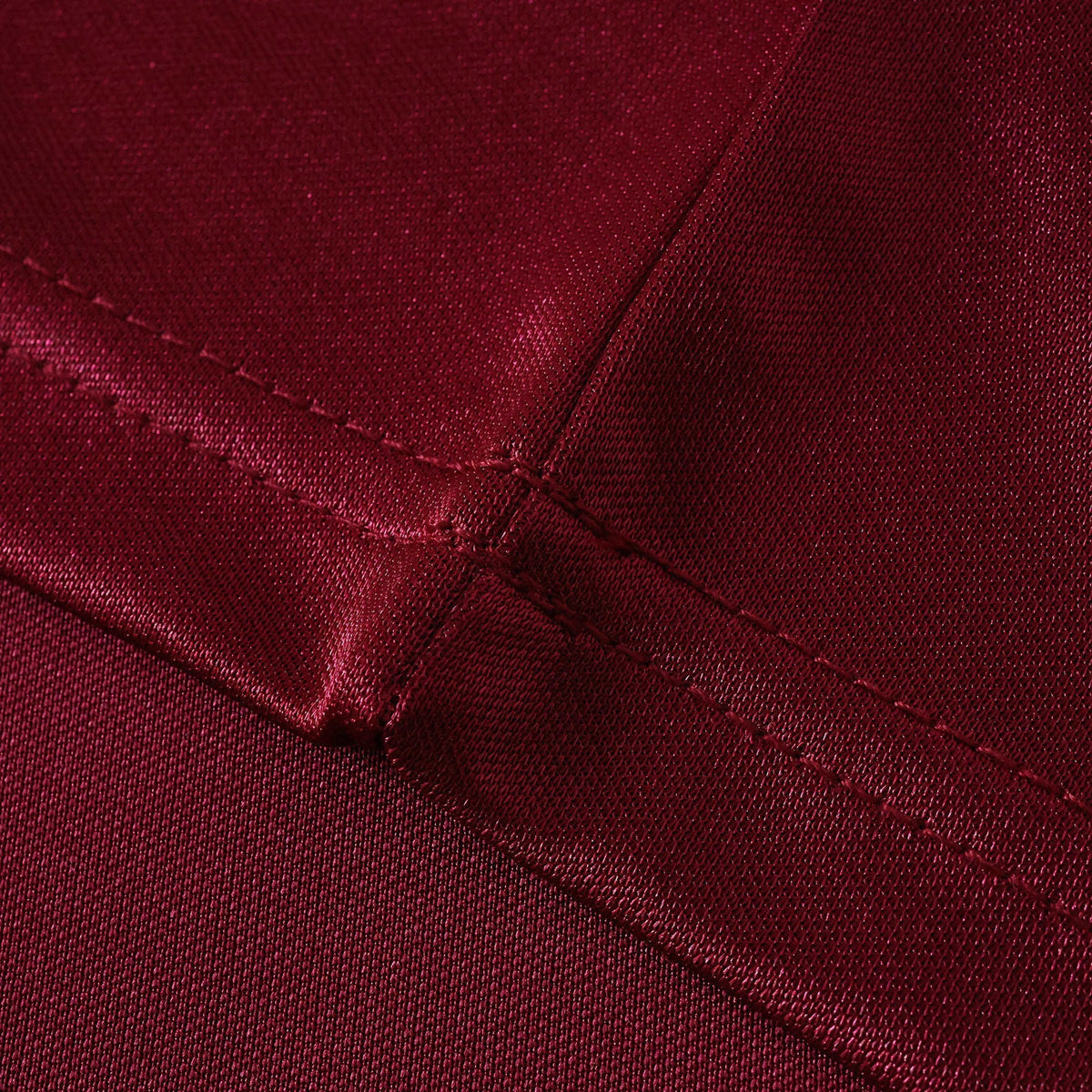 Close-up of the deep red fabric and stitching on an Elite Retro Kits Roma 1992-94 home football shirt.