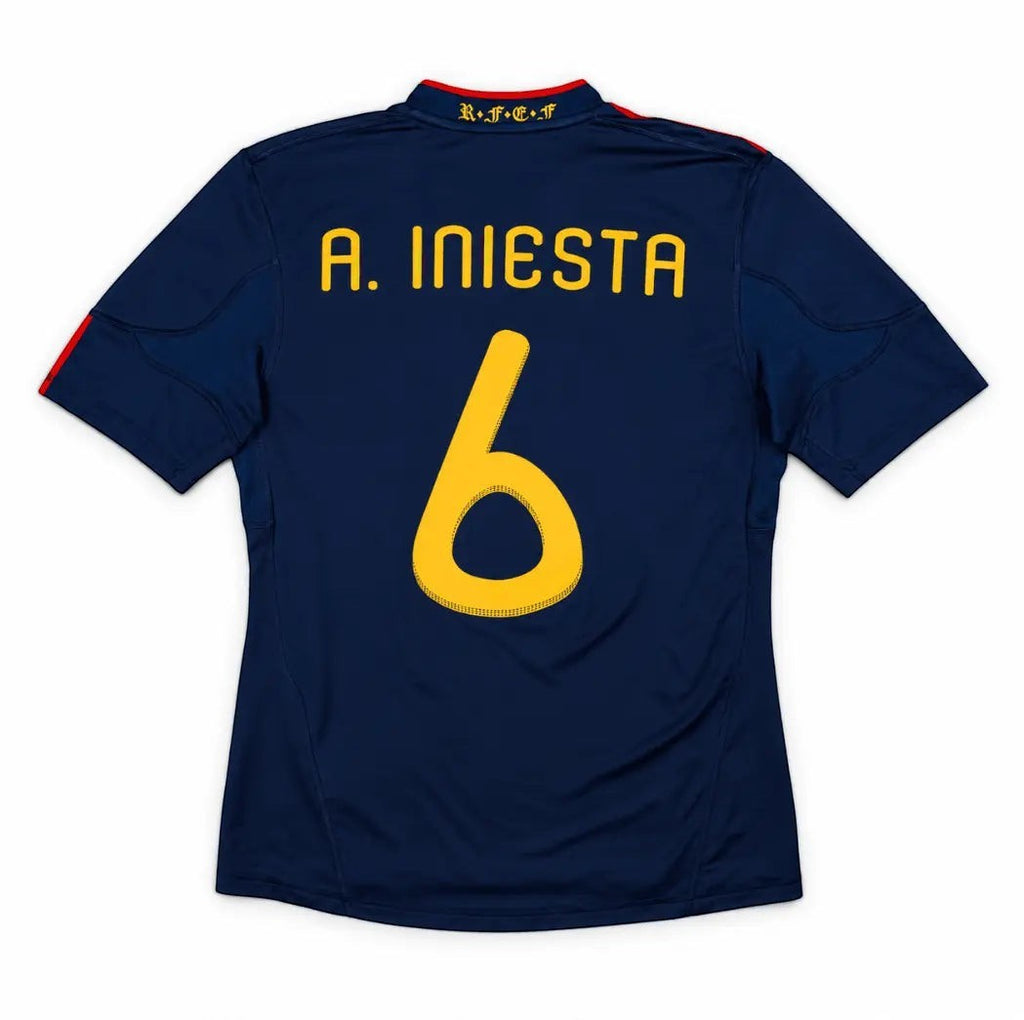 Elite Retro Kits Spain 2010 World Cup final away shirt in navy blue with Iniesta 6 in gold lettering on the back