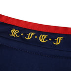 Elite Retro Kits Spain 2010 World Cup final away shirt featuring navy blue fabric with gold RFEF embroidery and red trim