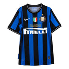 A Nike Inter Milan soccer jersey with vertical blue and black stripes, featuring the Pirelli sponsor logo, Inter Milan crest, and a gold Final Madrid 2010 patch on the chest.