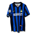 A vintage soccer jersey featuring black and blue vertical stripes with a Pirelli sponsor logo, Nike logo, and Inter Milan club crest.