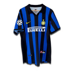 A vintage soccer jersey featuring black and blue vertical stripes with a Pirelli sponsor logo, Nike logo, and Inter Milan club crest.