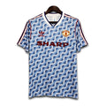 Manchester United jersey with patterned design on a white background