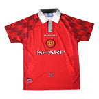 A red Manchester United short-sleeve soccer jersey with a white collar, featuring the Umbro logo, Manchester United crest, and Sharp sponsor logo on the front.