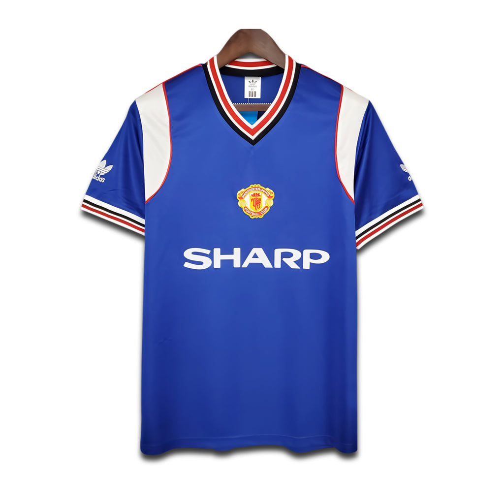 Blue sports jersey with red and white accents on a hanger against a white background